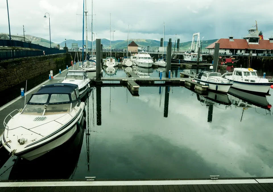 Boats moored at pontoons in a marina